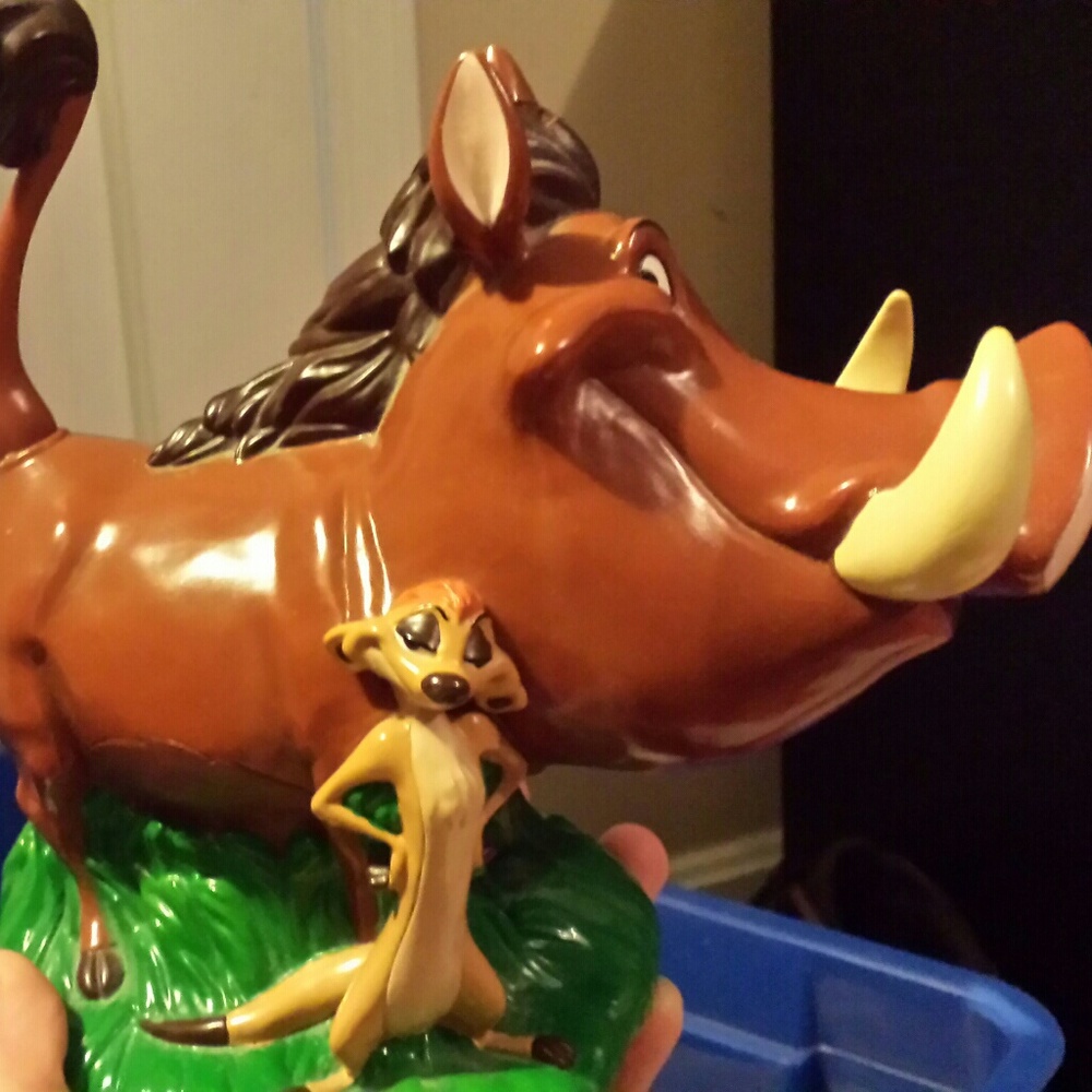 Timon and puma piggy bank.  Never used.