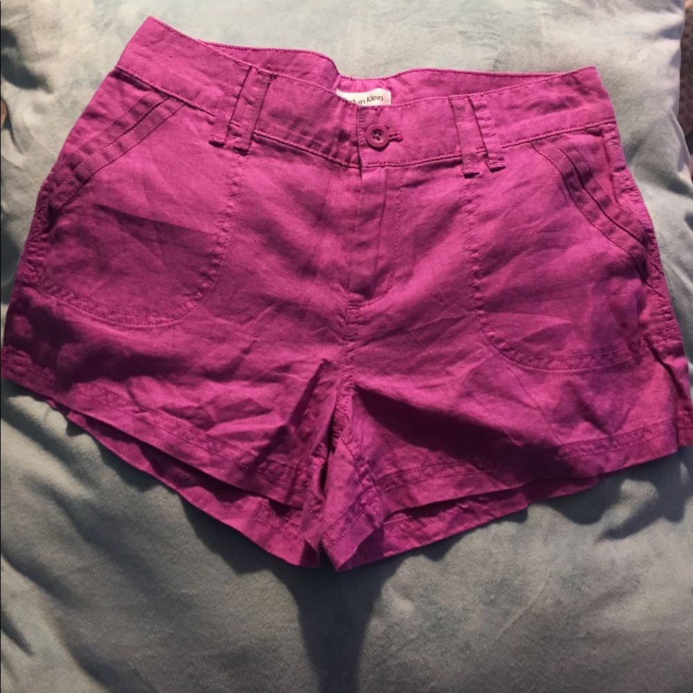 Pink linen shorts.
