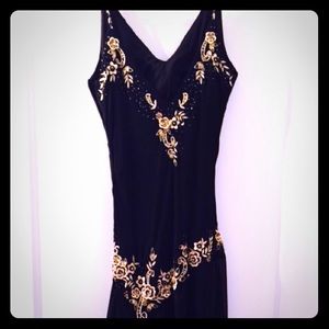 Black evening dress with gold beaded accent.