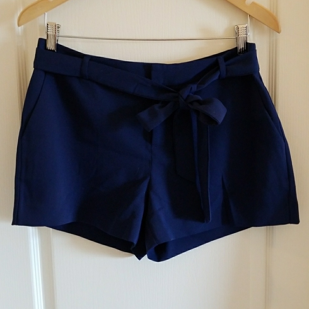 Navy dress shorts. Front zip, sash tie waist.
