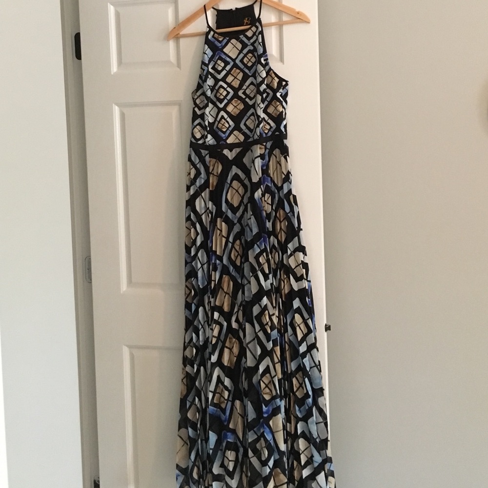 Graphic print razorback dress with pleats.