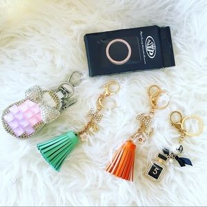 Bundle 2 keychain 1 key ring and 1 key holder