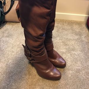 Knee high cognac color boots with strap detail