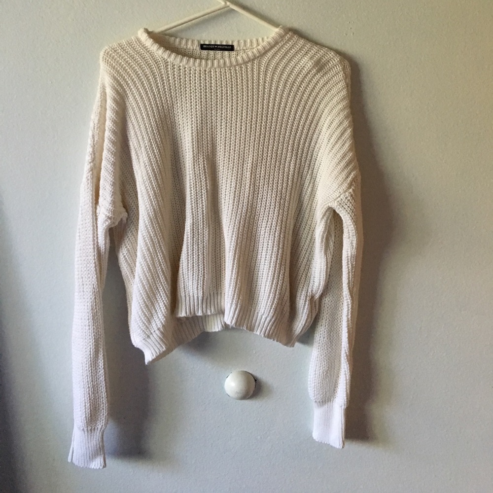 Loose white knit sweater