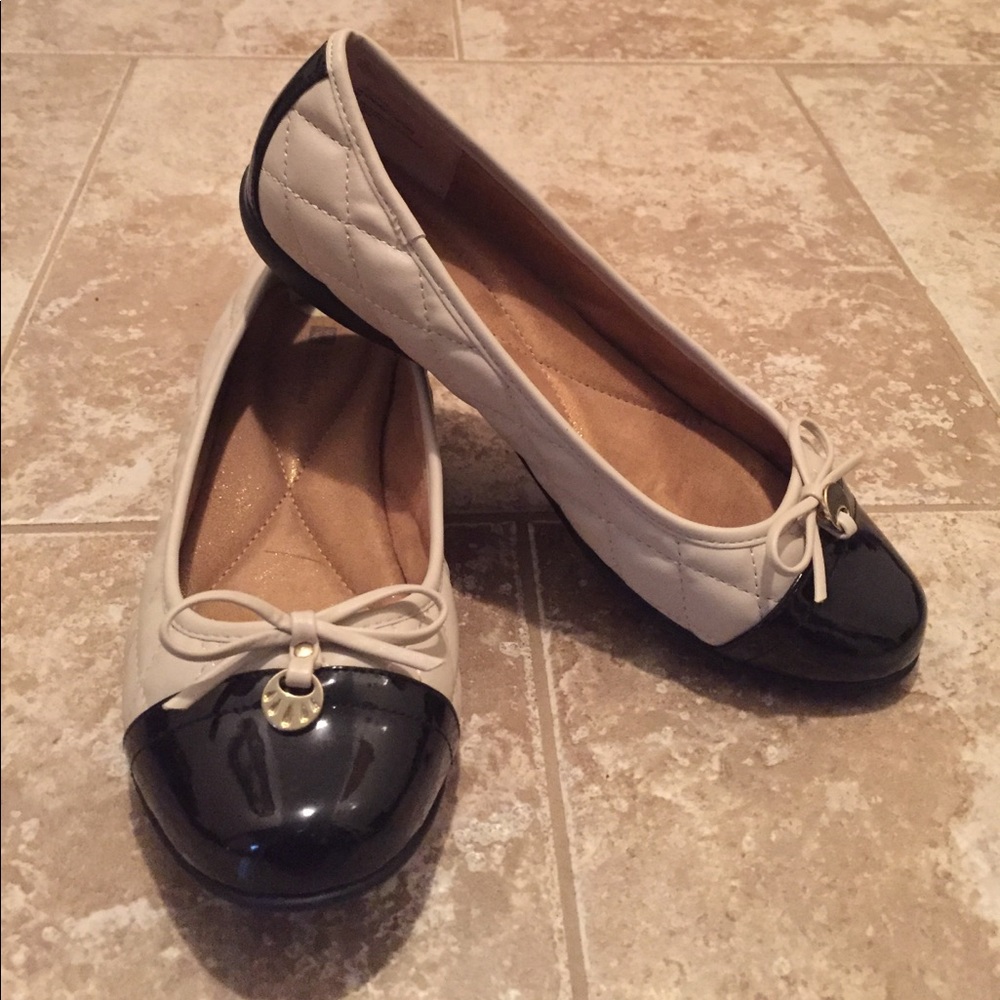 Tan and black flats