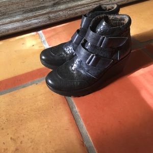 Black wedge booties/hightops by Fly