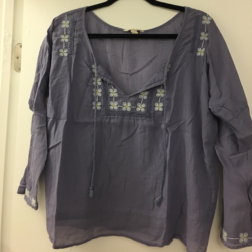 Purple blouse embroidered with flowers