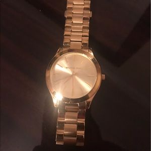 Women's gold Michael Kors watch