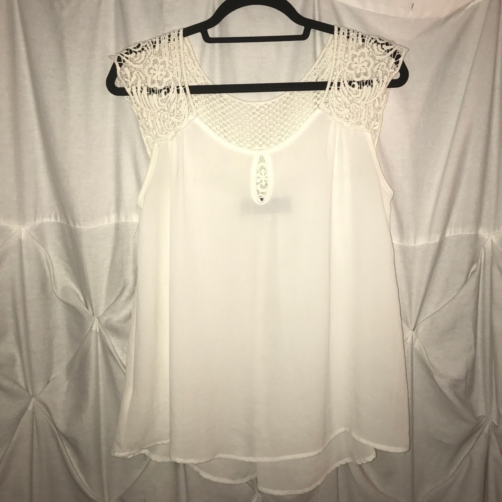 White blouse with crochet detailing.
