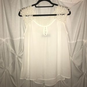 White blouse with crochet detailing.