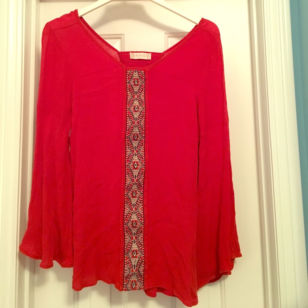 Orange flowy bell sleeve blouse