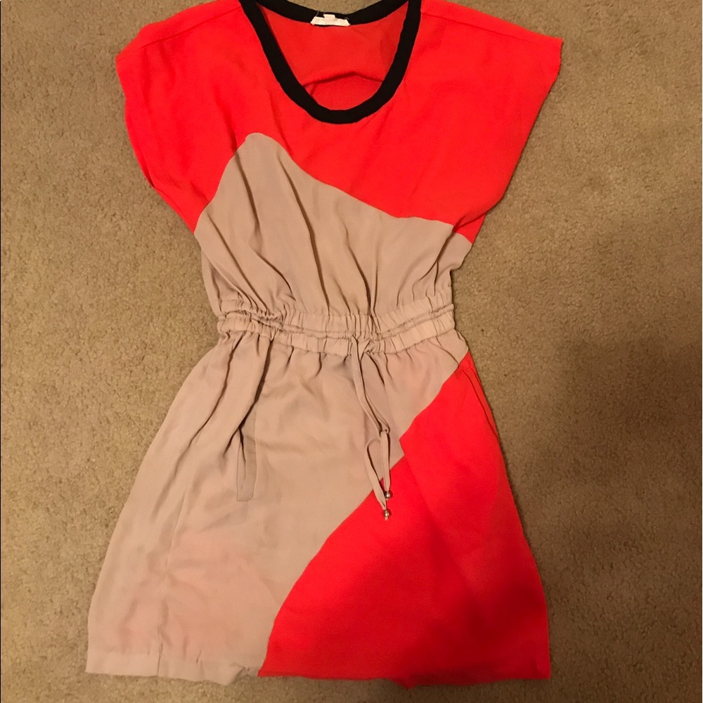 A nude and orange dress