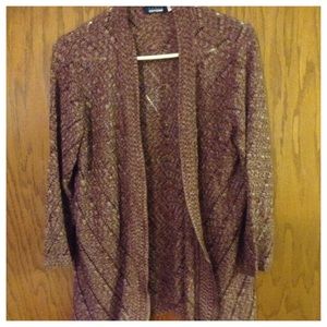 Maroon and white sweater throw