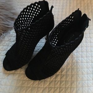 Ivanka Trump black suede cage heels.