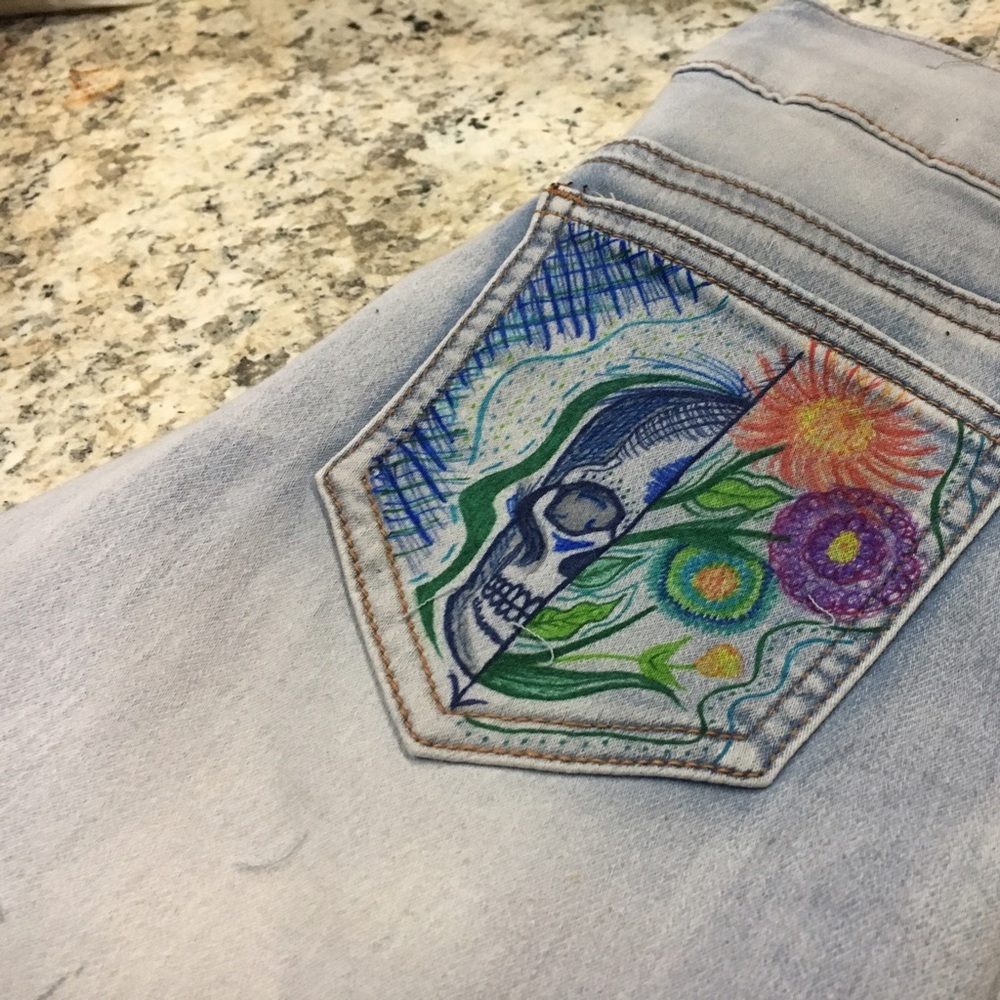 Jeans w/ distressing and sharpie art on pockets