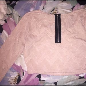 Light pink crop top with a black zipper on back