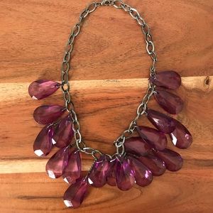 Purple jewels on a black/silver metallic chain.