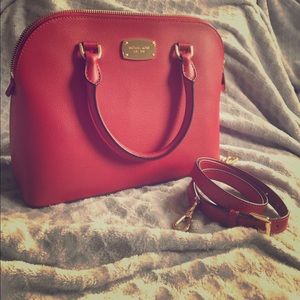 Michael Kors handbag with shoulder strap.