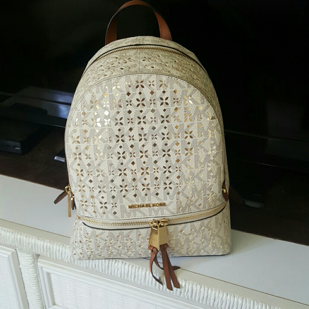 Michael Kors Gold Perforated Floral Backpack