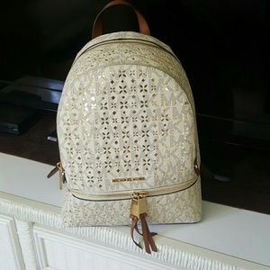 Michael Kors Gold Perforated Floral Backpack