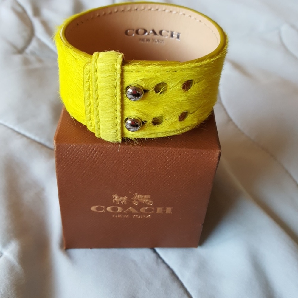 COACH yellow fuzzy wristlet..adjustable