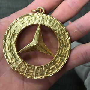 Mercedes 14k plum gold pendant