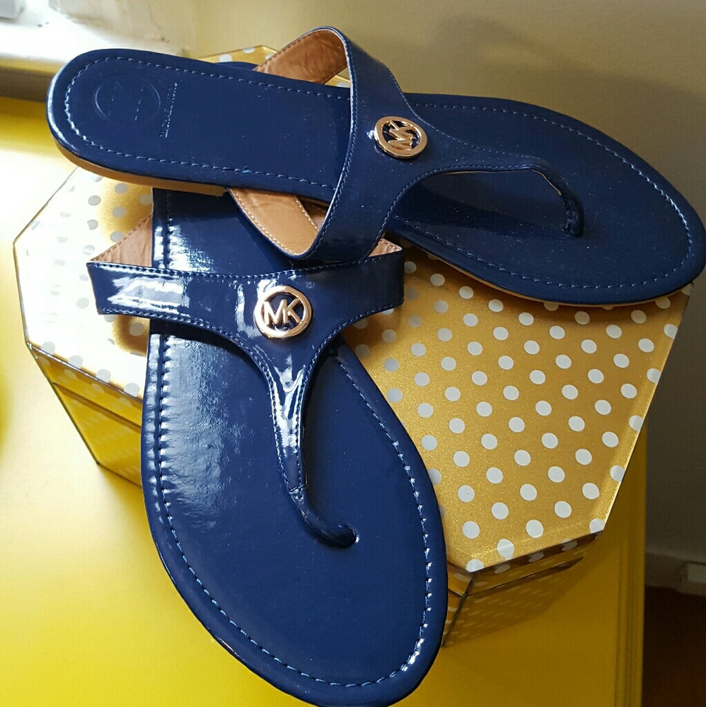 Michael Kors navy flip flops. NWOT!