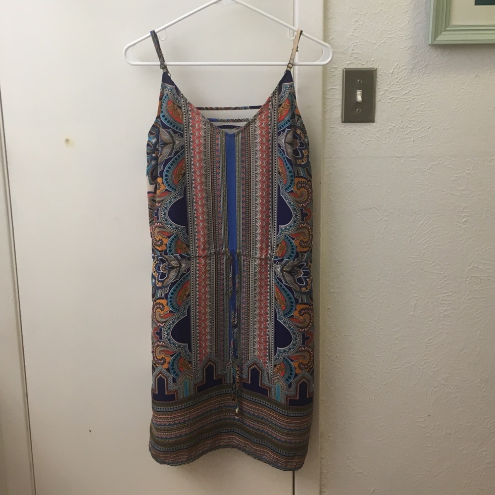 Knee length dress, with adjustable straps.