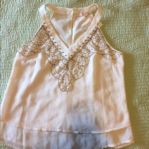 Tan embellished tank top.