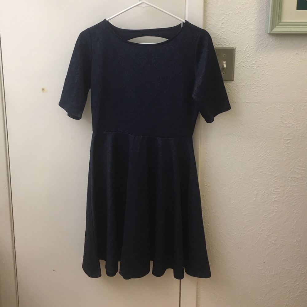 Knee length dress, with  sleeves, peekaboo back.