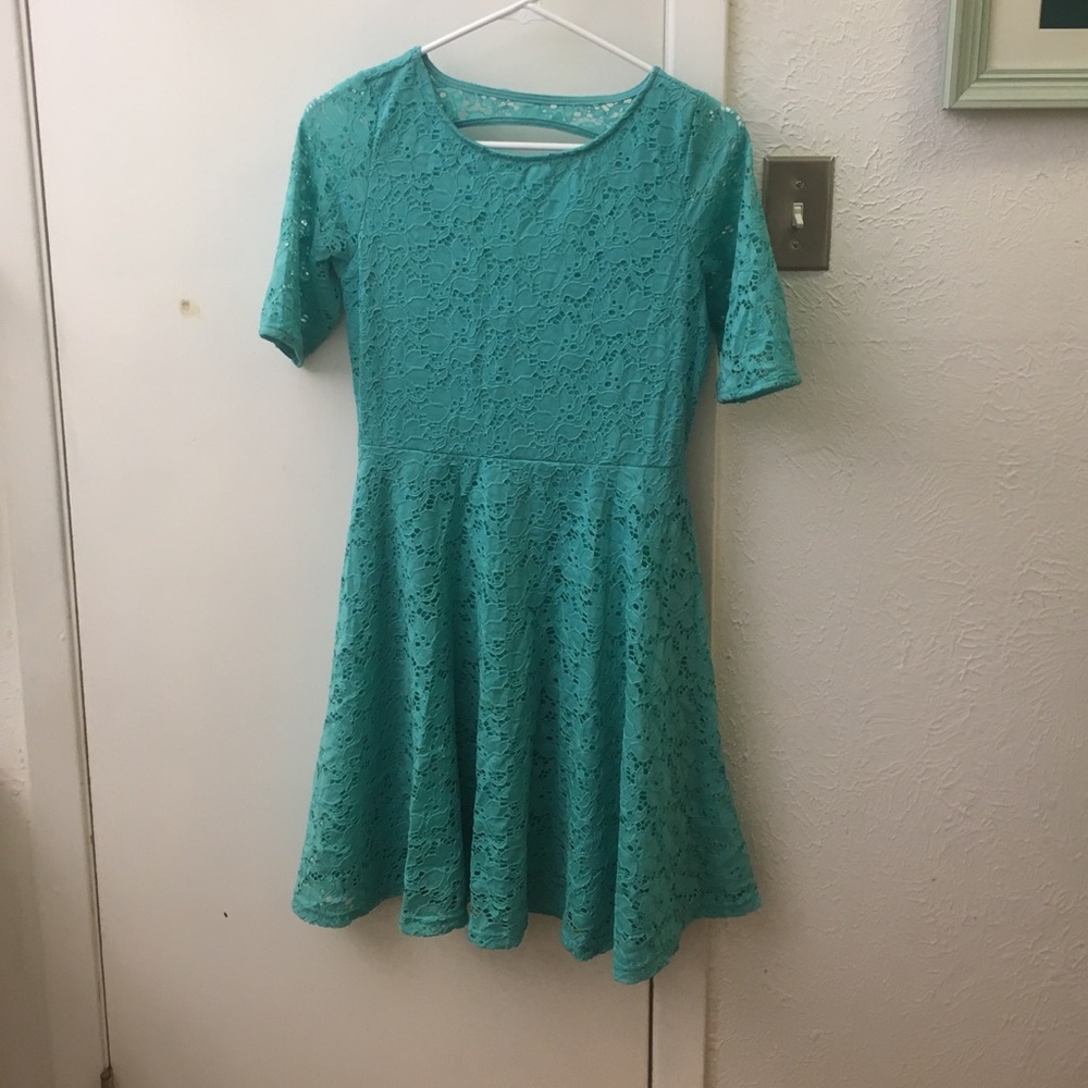 Knee length dress, with  sleeves, peekaboo back.