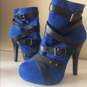Blue booties with black leather straps