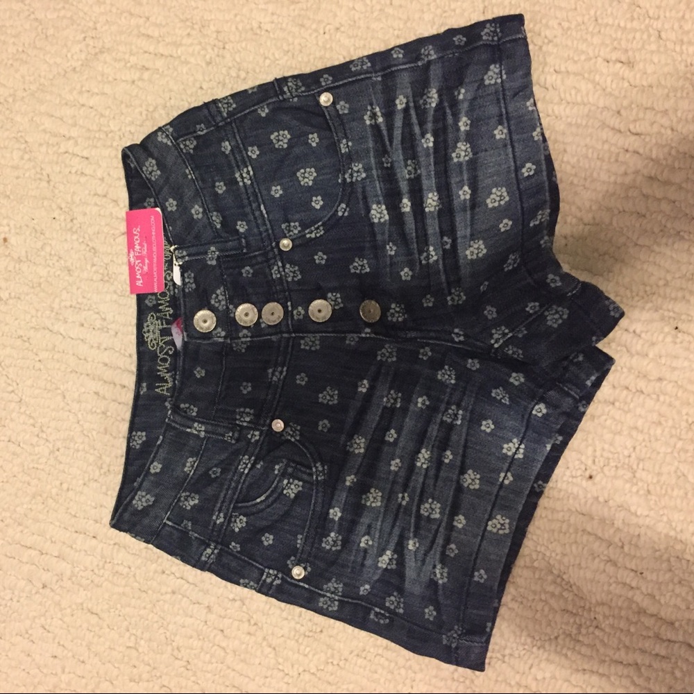 Button-up high-waisted flower jean shorts