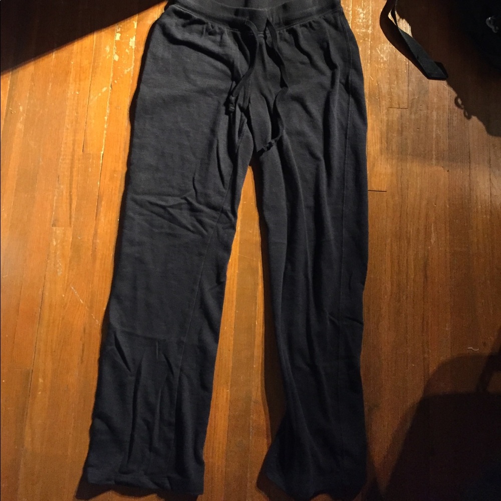 Black sweatpants with pockets on the back.