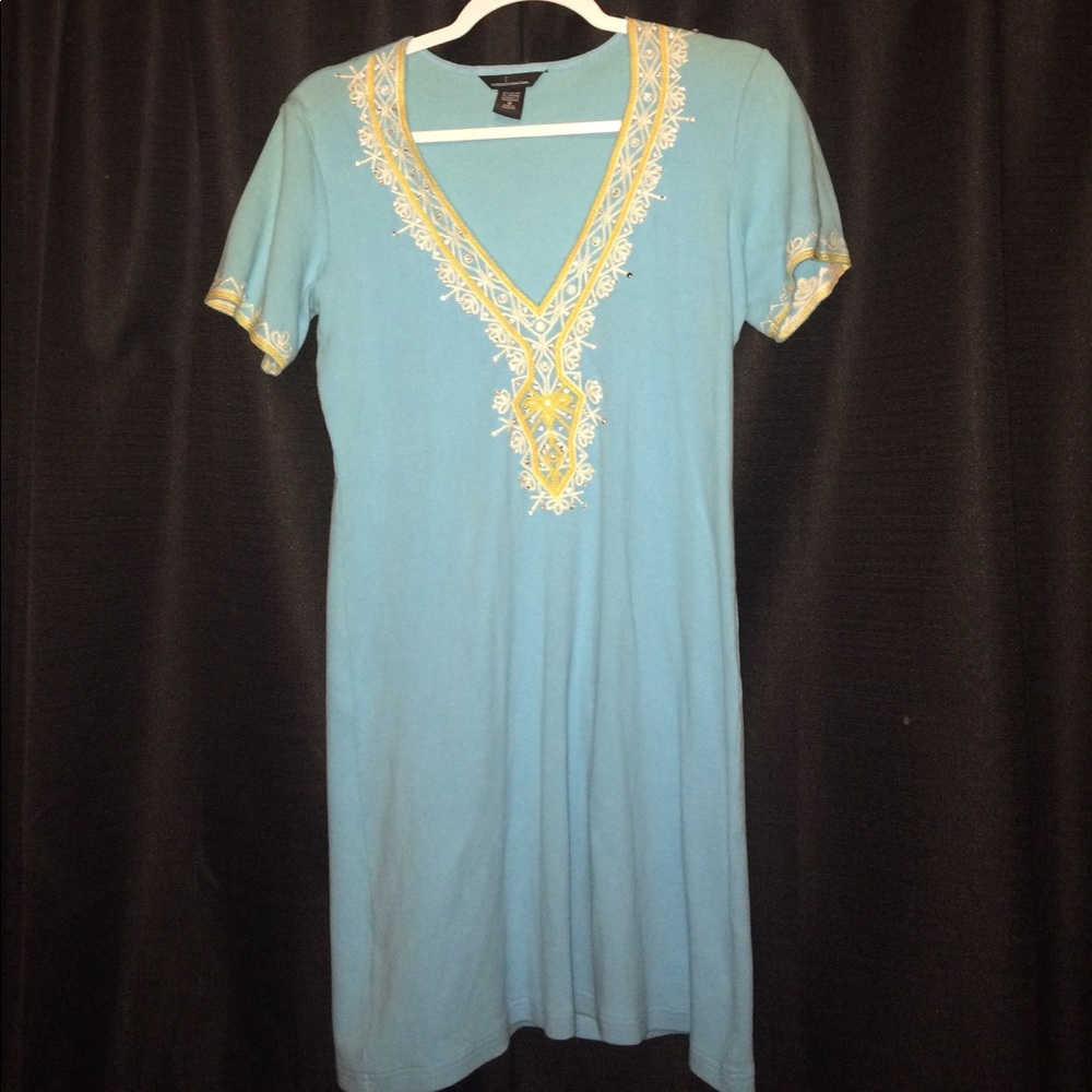 Comfortable dress, turquoise with embellishments.
