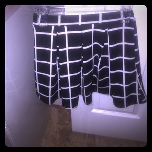 Black and white skater skirt . New with tags ! Black and white skater skirt . New with tags !