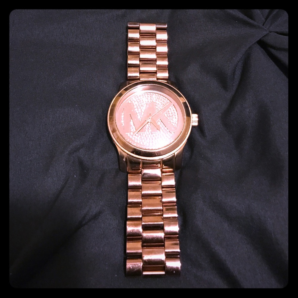 This is a rose gold authentic Michael Kors watch.