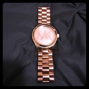 This is a rose gold authentic Michael Kors watch.
