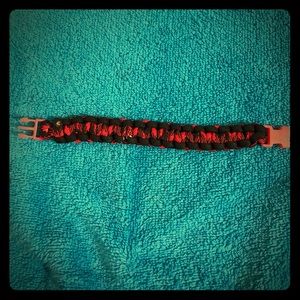 Cord bracelet homemade Red Black and green.