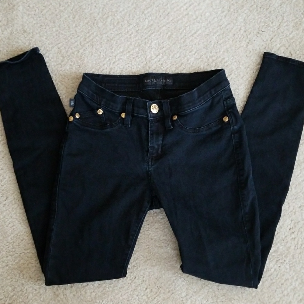 Black skinny jeans, gold accents