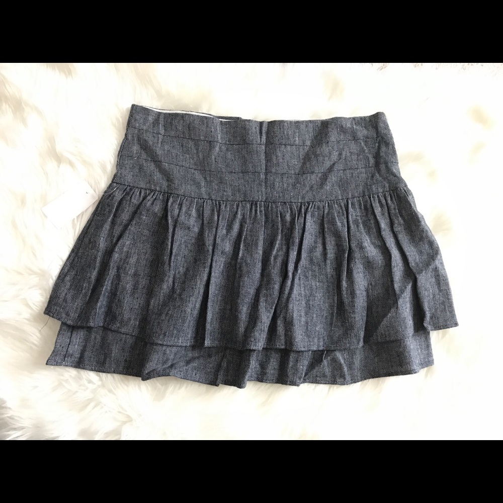 Denim ruffle skirt with back zip. Size Large. NWT
