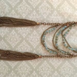 gold necklace with blue/green/teal beads & tassels