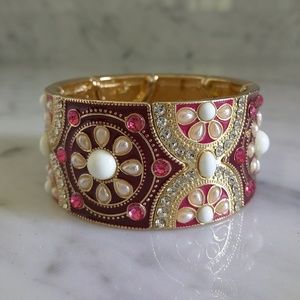 Enamel, rhinestone, faux pearl stretch bangle