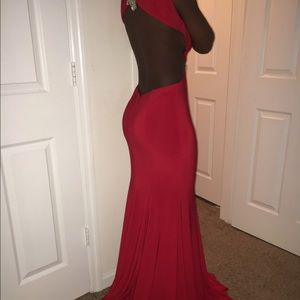 Red backless prom dress with slit.