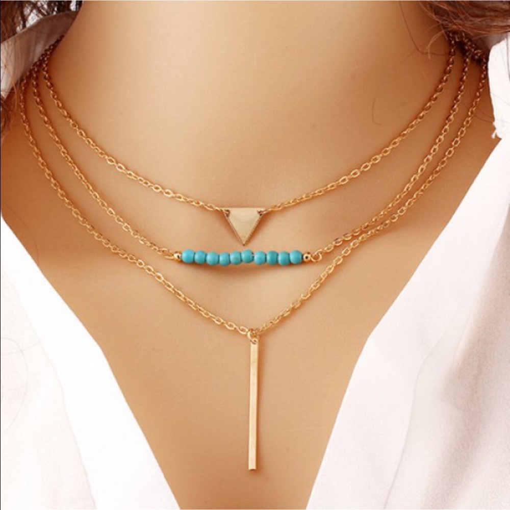 Layered necklace with gold bar and beaded accent!
