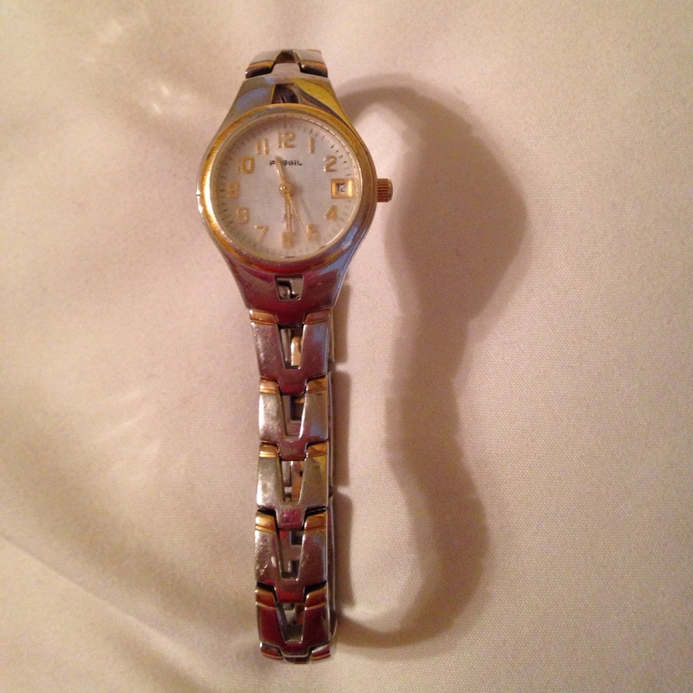 Silver and gold Fossil watch.