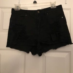 Black distressed booty shorts
