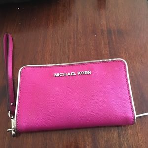 Adorable hot pink Michael Kors phone wallet Adorable hot pink Michael Kors phone wallet