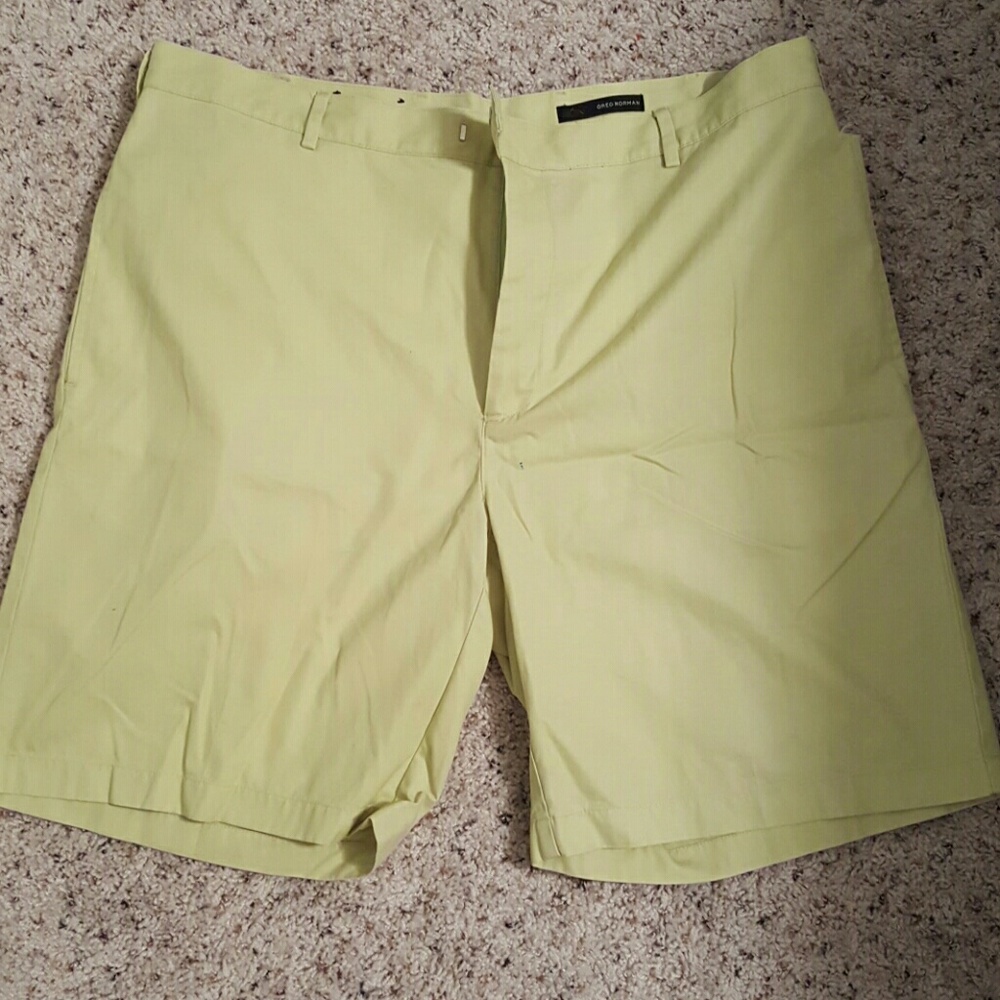 Shorts greenish, yellow color.