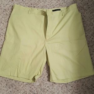Shorts greenish, yellow color.
